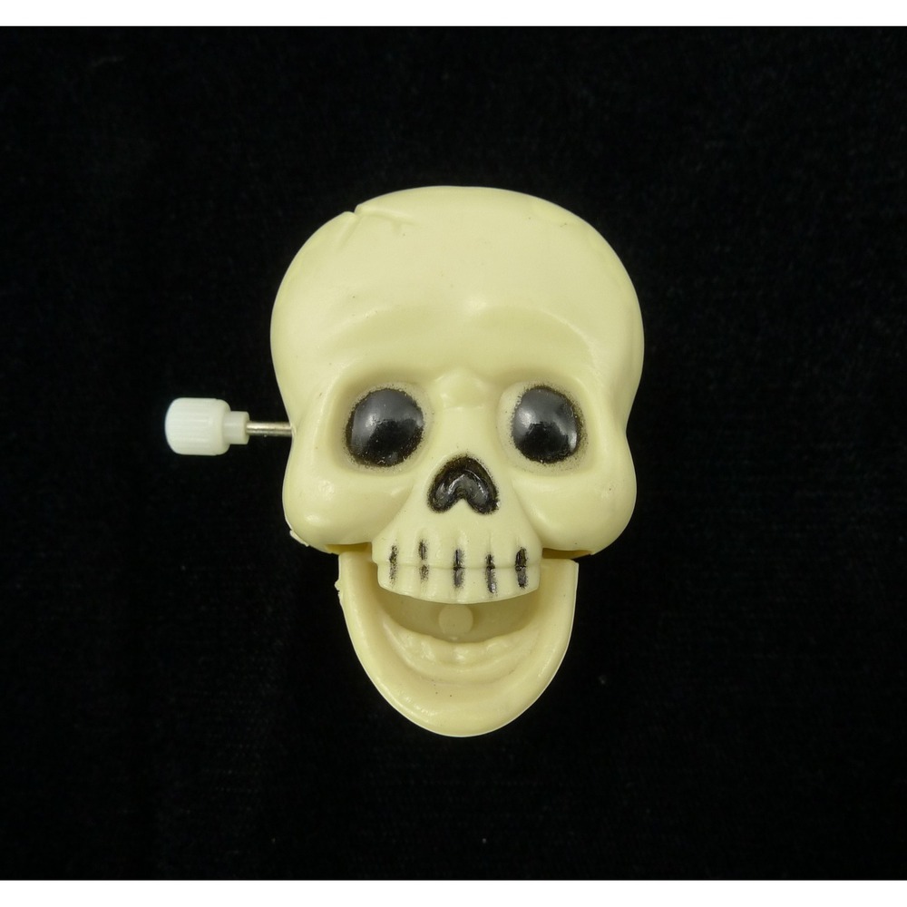 Vintage Plastic Wind-Up "Laughing/Chattering" White Skull Pin/Clip-On Back